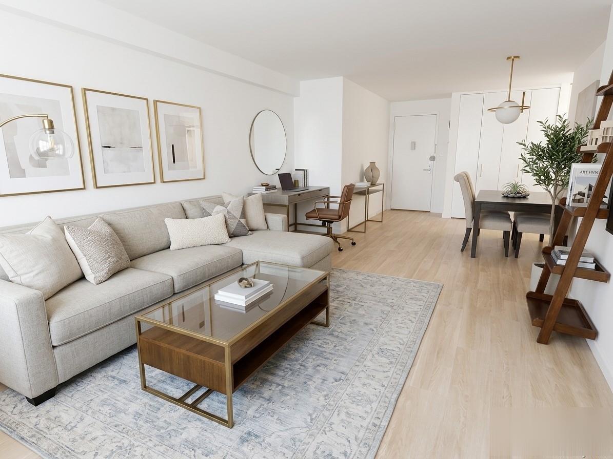 Open-plan Southbridge living and dining area with light wood floors and designer furnishings
